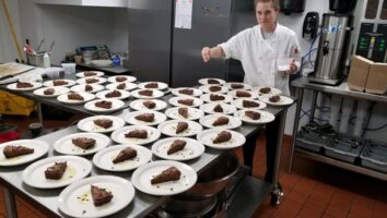 Chef finishes party cake